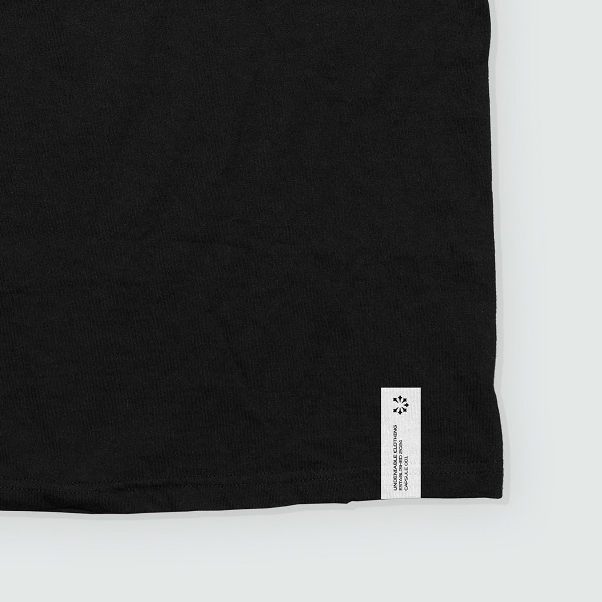 UDN CAPSULE TAG TEE