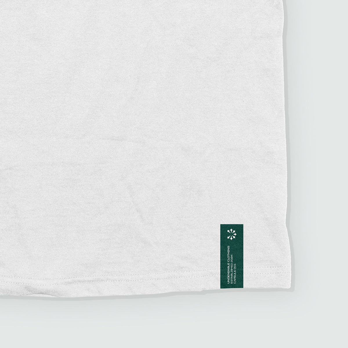 UDN CAPSULE TAG TEE